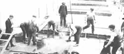 Employees repair the Frank Rockefeller